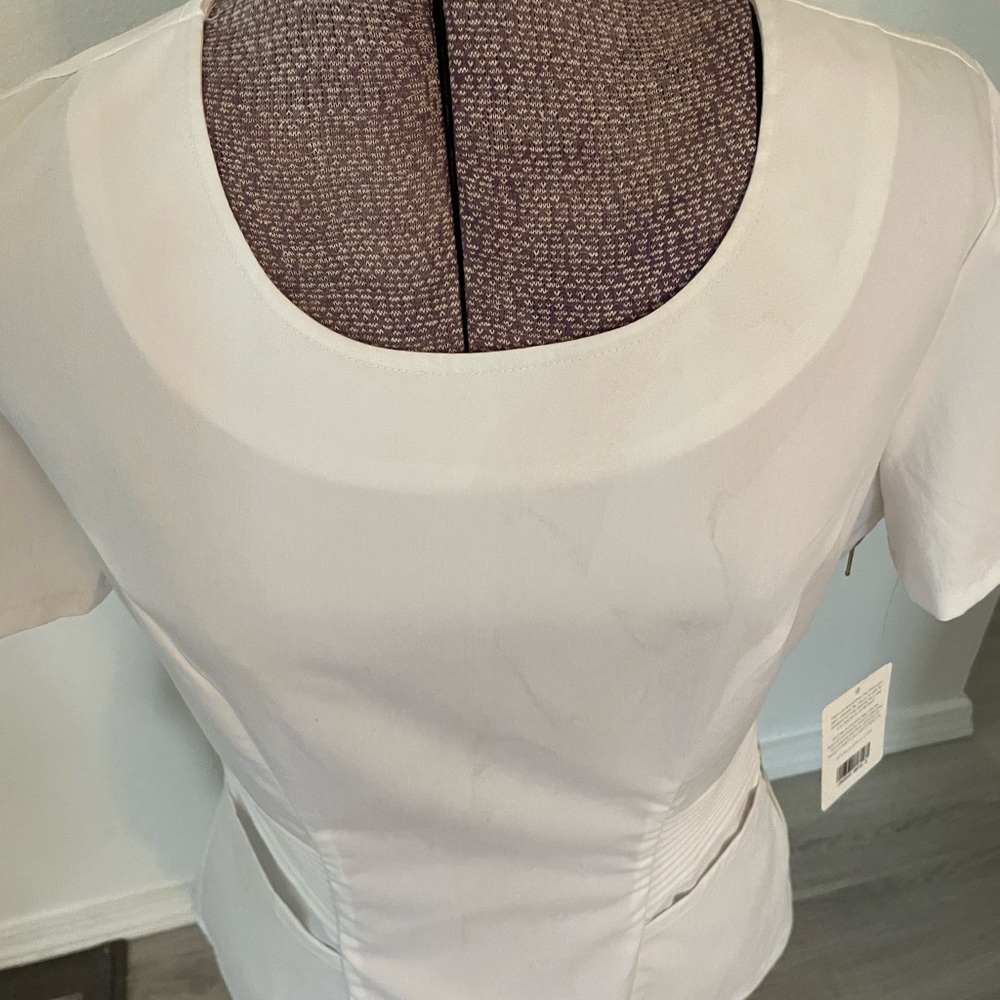 Jaanuu White Scrub Top with Slimming Pleats and Gold Side Zipper - Picture 11 of 11